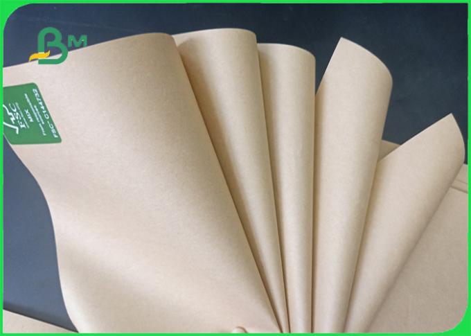 O rasgo da largura 70*100cm resistente alisa 70 de superfície - papel de embalagem de FDA do marrom 80g no rolo